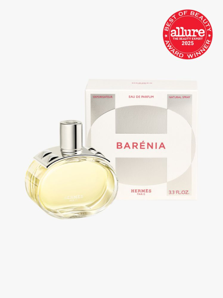 Hermès Barénia Eau de Parfum oval bottle of pale yellow perfume with silver cap with studs and box on light gray background with red Allure Best of Beauty seal in the top right corner on light gray background