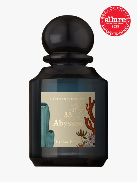 L'Artisan Parfumeur dark teal bottle of perfume with sea-themed label and bauble cap on light gray background with red Allure Best of Beauty seal in the top right corner